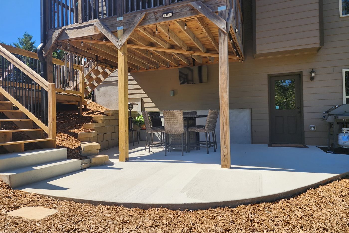Covered timber-frame pavilion over a paver patio at an upscale North Georgia home