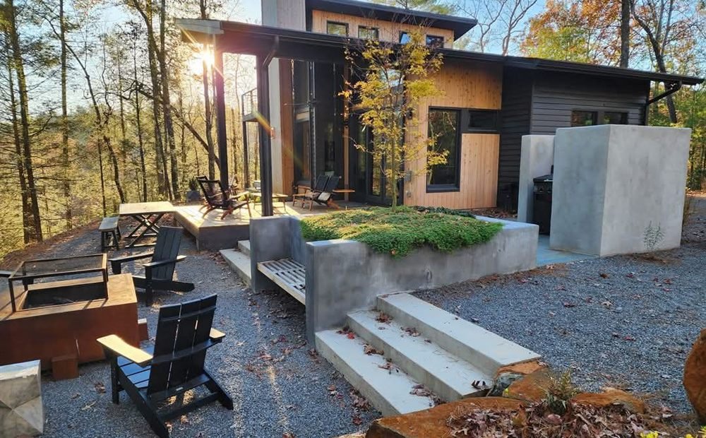 Terraced patio with stone steps and loungers in golden evening light