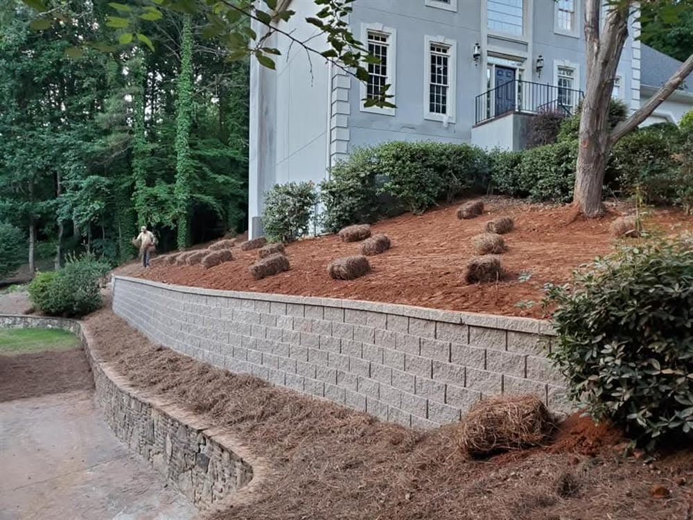 Terraced modular block retaining wall on a pine-straw slope