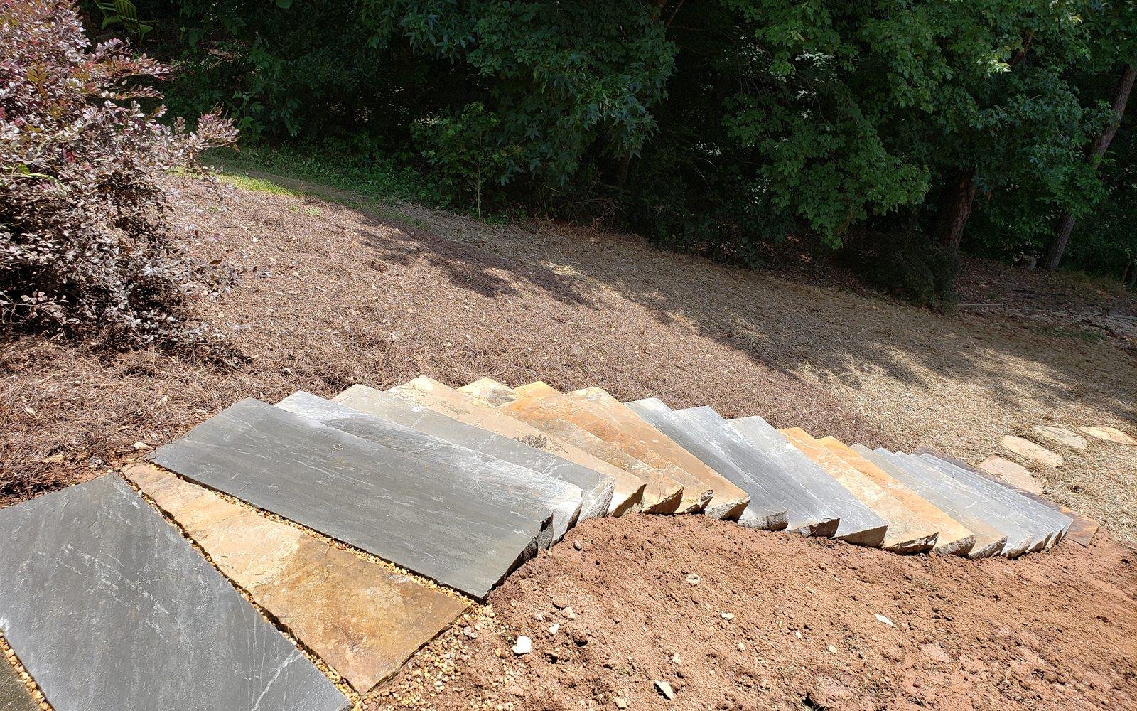 Bluestone stair treads set into a landscaped hillside